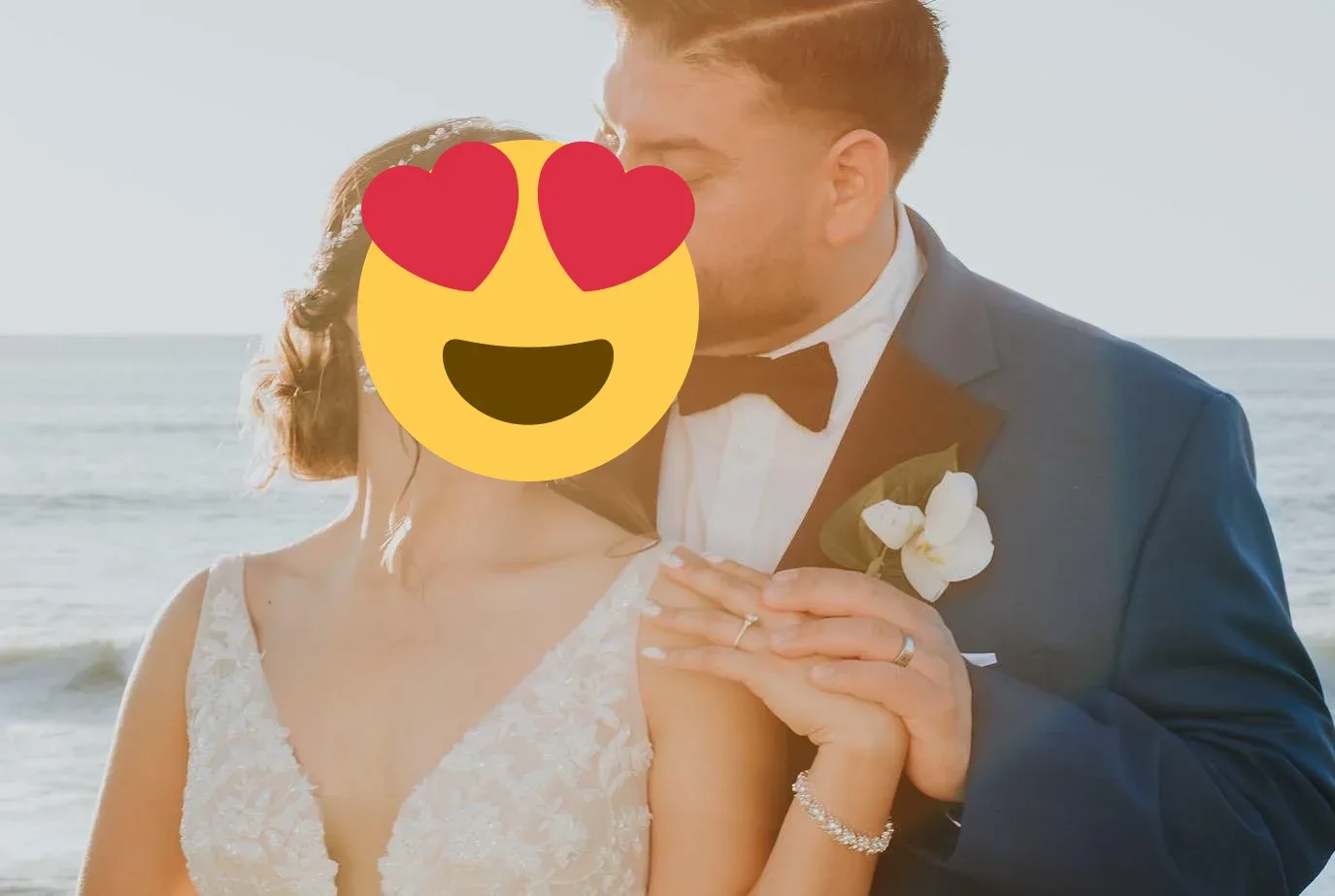 A close portrait of a wedding couple with white orchids in coastal light