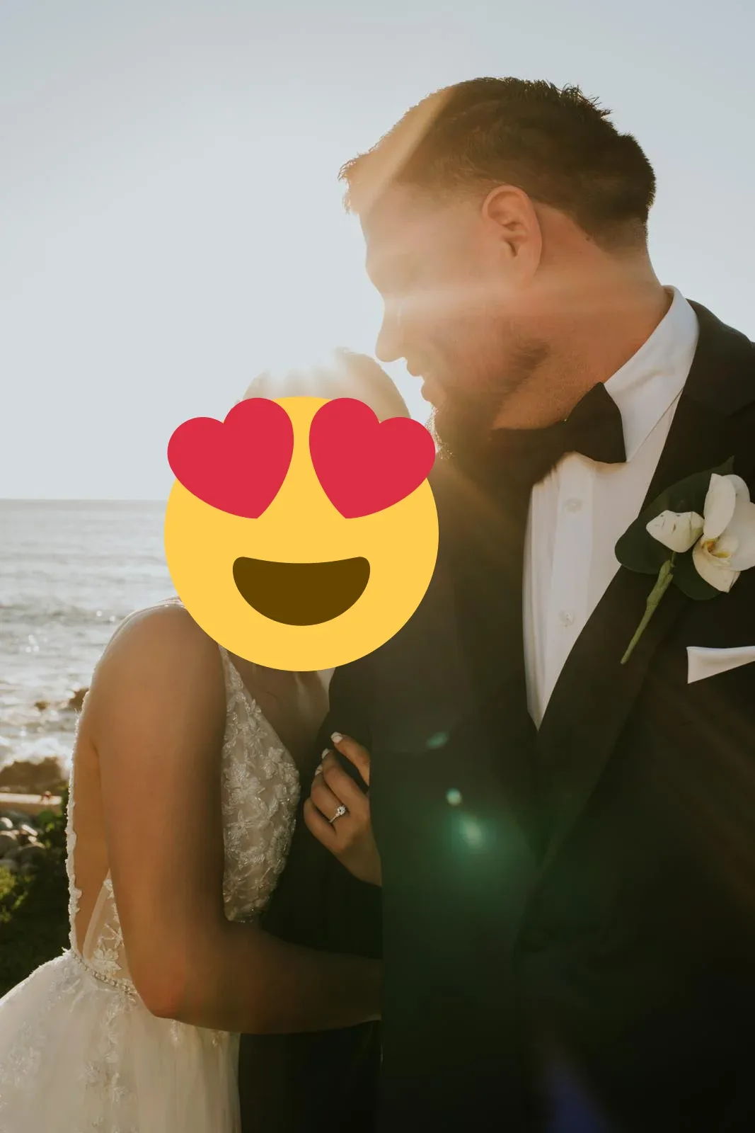 A wedding couple embracing with sunlight falling across their portrait